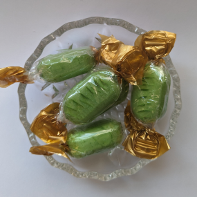 Green choc lime sweets on glass dish