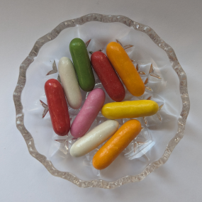 Colourful liquorice confit sweets on glass dish