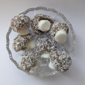 Coconut mushroom sweets on a glass dish