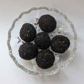 Rum ball sweets on glass dish